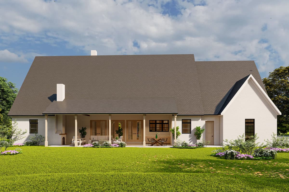 House plan exterior: Modern Farmhouse style, one story, featuring a covered porch with columns, multiple gables, and two chimneys.