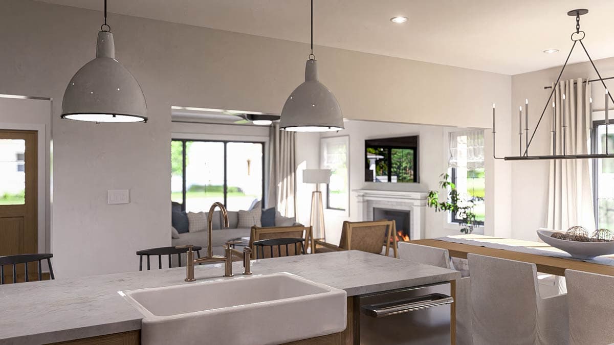Open concept kitchen and living area with island sink, fireplace, dining table, and large windows.
