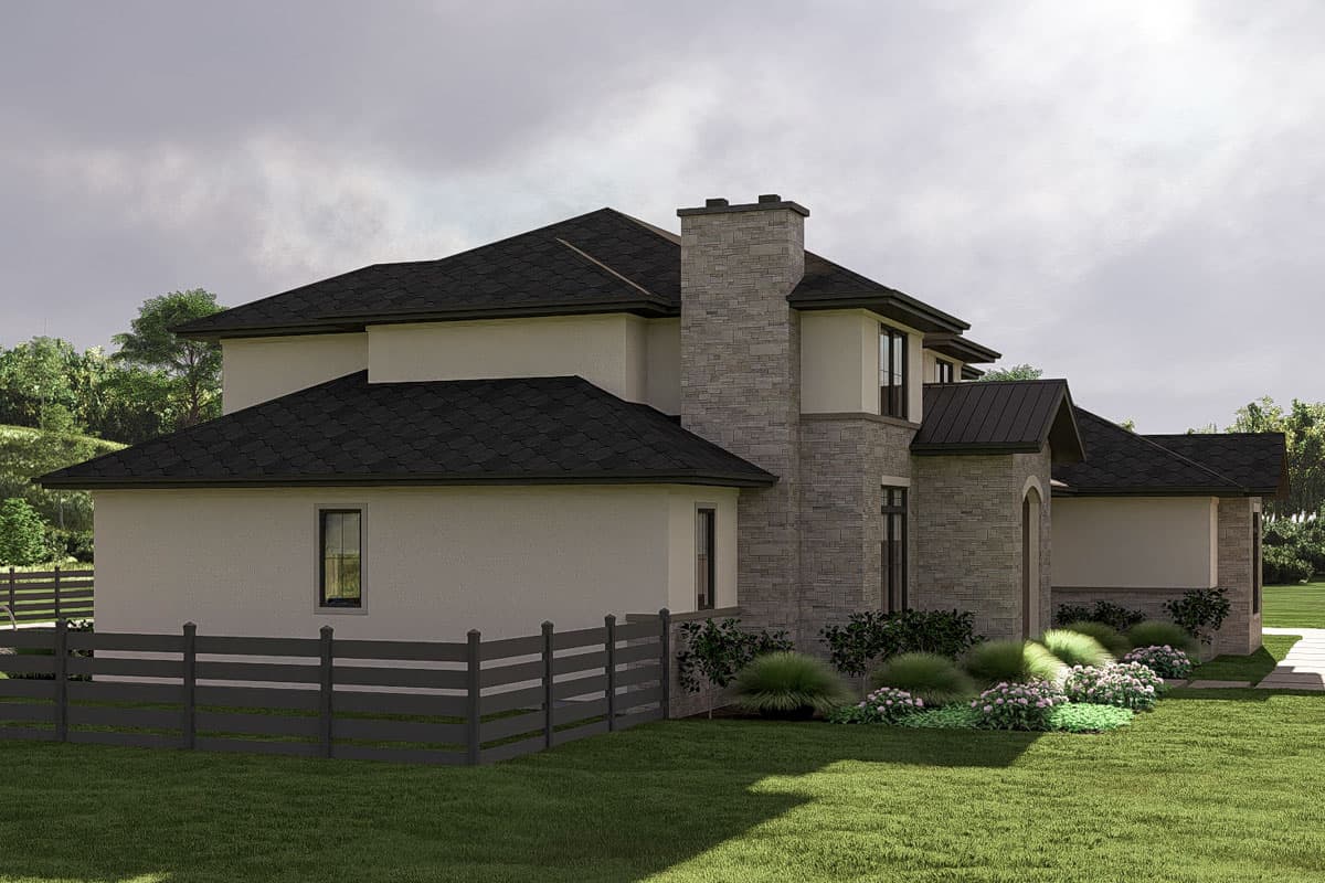 House plan exterior view of two-story home with stone chimney, gables, and dark pitched rooflines.