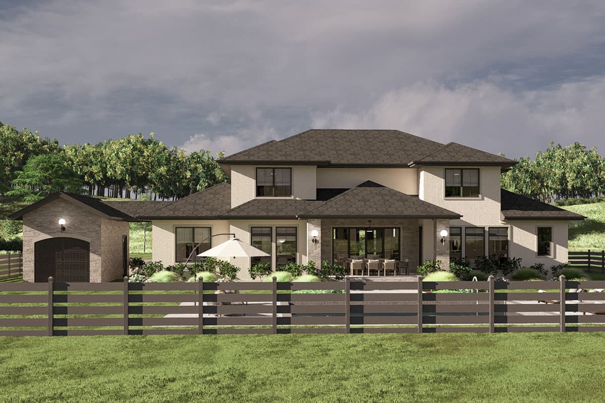 House plan exterior: Two-story home with attached garage, pitched roof, and large windows overlooking backyard patio.