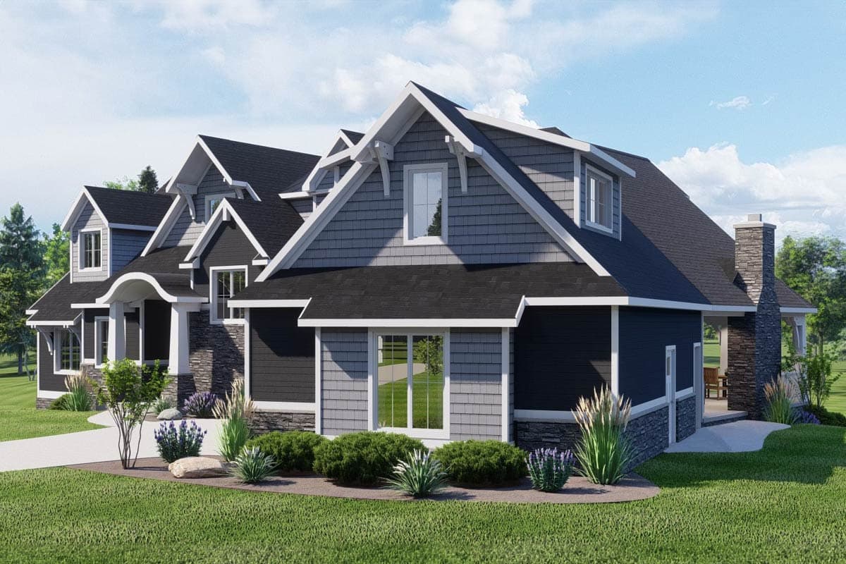 House plan exterior with multiple gables, dormers, stone accents, and a prominent chimney.