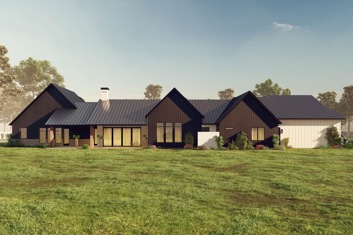 Modern Farmhouse house plan exterior with dark siding, metal roof, gables, covered porch, and attached garage.