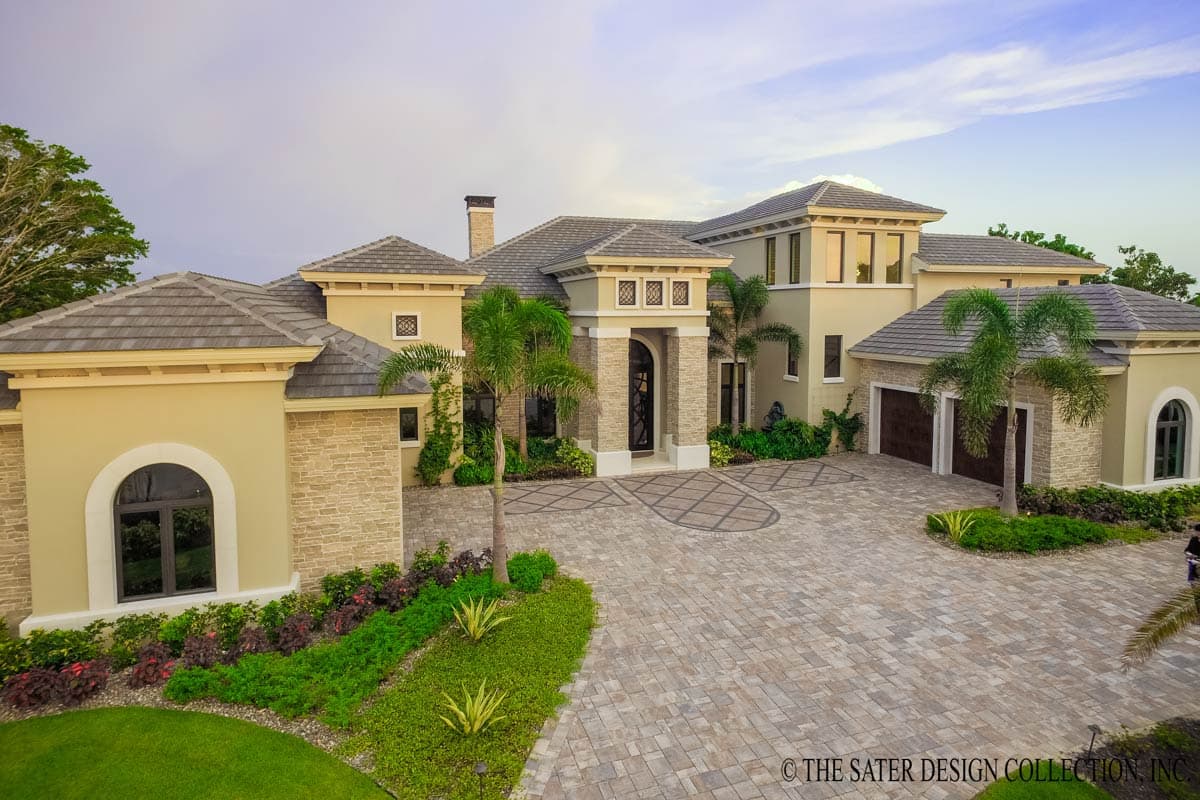 House plan exterior featuring a two-story residence with multiple gables, arched windows, stone accents, and a three-car garage.
