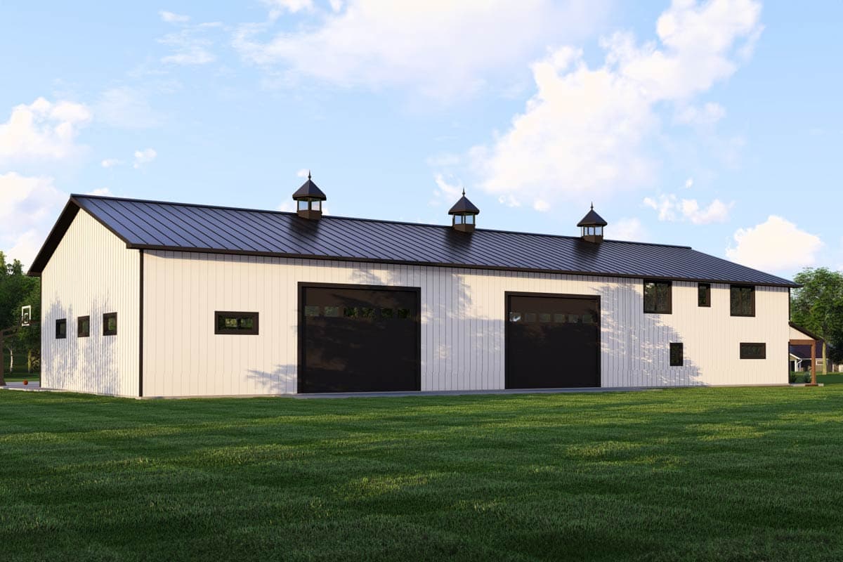 Barn-style house plan exterior with white vertical siding, black metal roof, two large garage doors, and three cupolas.