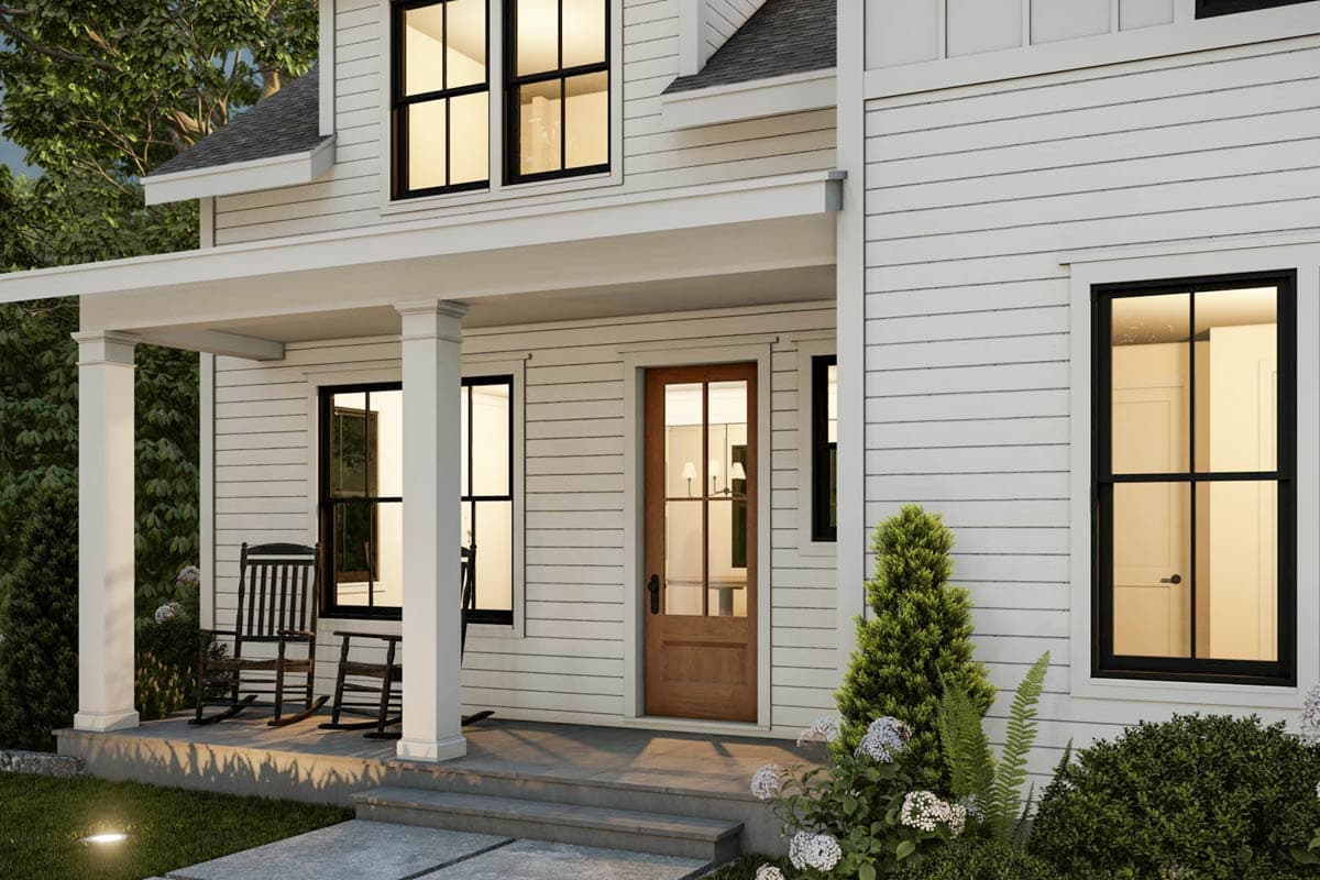 Modern Farmhouse house plan exterior with a covered porch, two stories, white horizontal siding, and black-framed windows.