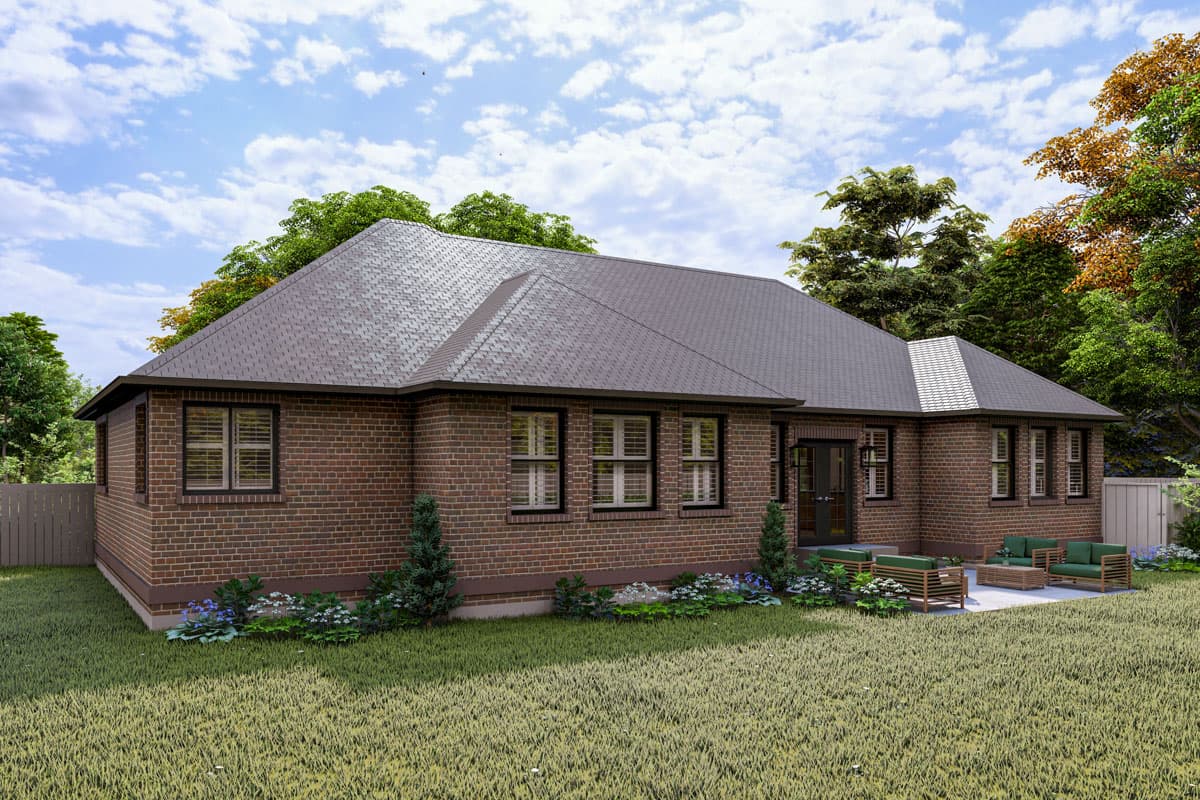 House plan exterior: One-story brick home with gabled roof, multiple windows, and a rear patio area.