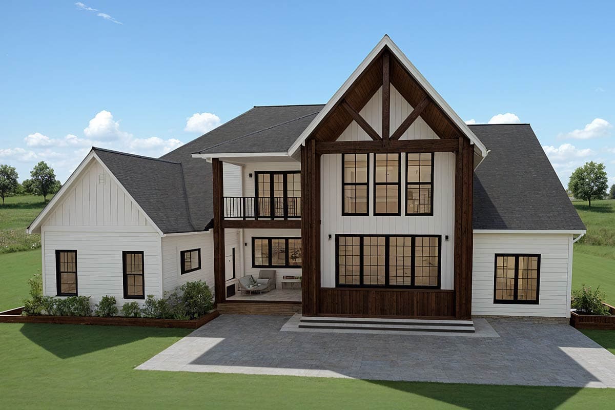 Modern Farmhouse house plan exterior with two stories, white siding, dark windows, and exposed wood beams.