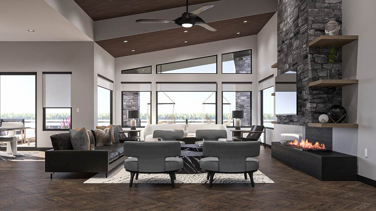 Interior rendering of a great room with vaulted ceilings, a stone fireplace, and large windows overlooking water.