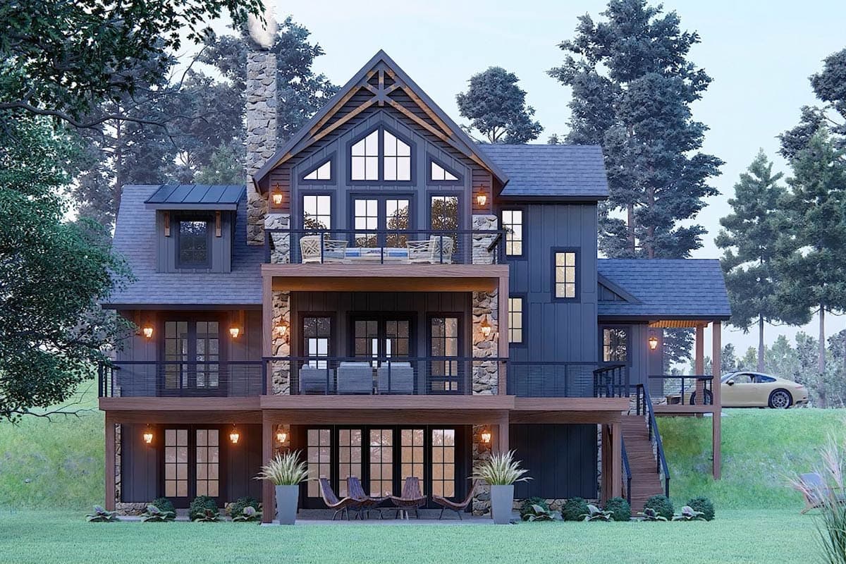 Modern Farmhouse house plan exterior with stone accents, multiple balconies, and a prominent gable with large windows.