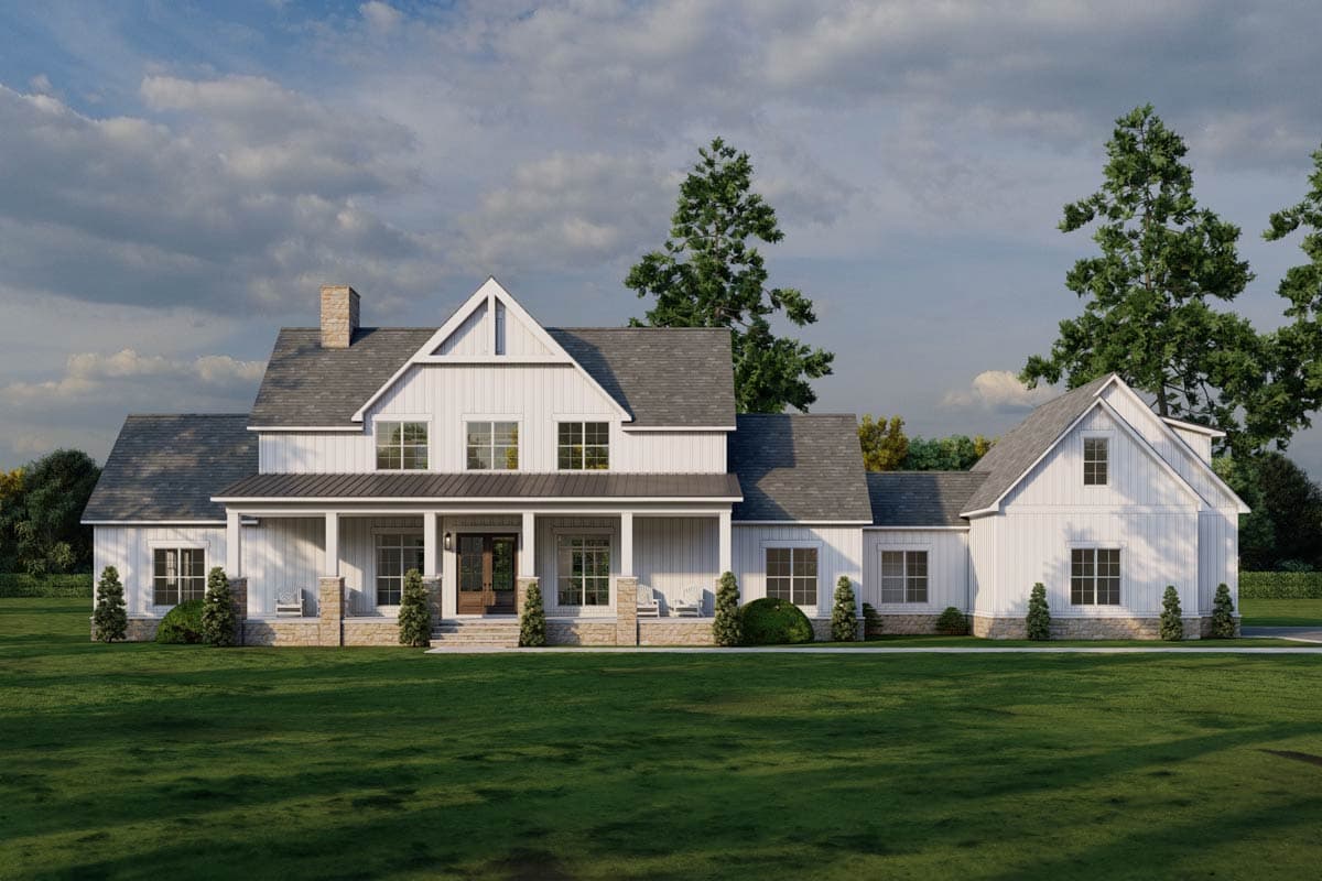 House plan exterior. Modern Farmhouse style with two stories, a covered porch, gabled rooflines, and a detached garage.
