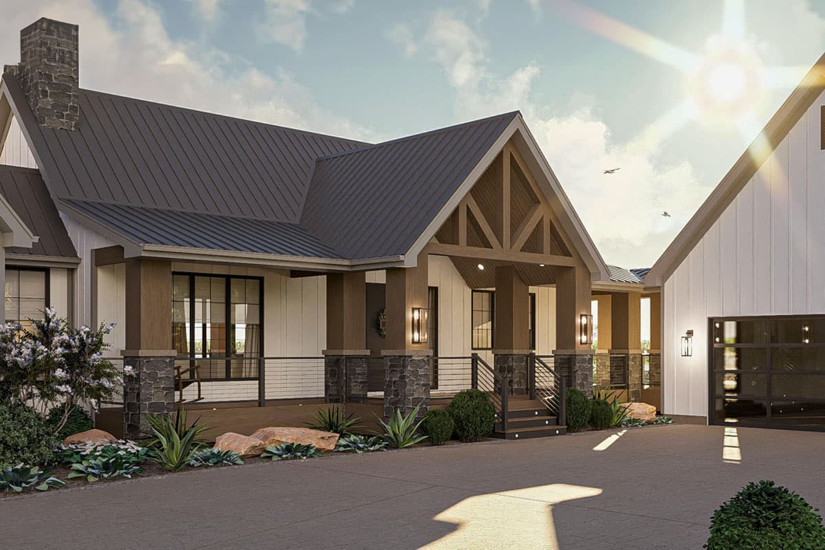 Modern Farmhouse house plan exterior with metal roof, stone chimney, covered porch, and detached garage.