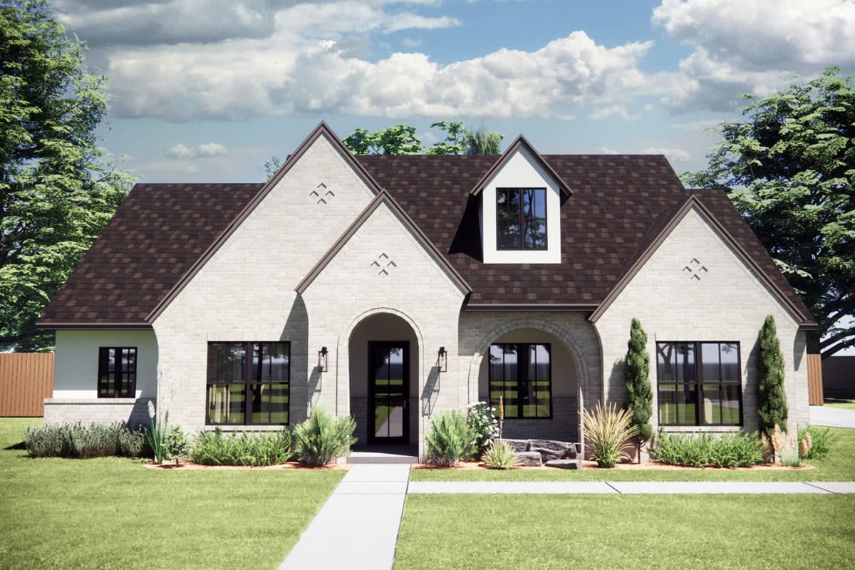 House plan exterior. Two-story with brick facade. Features include arched entryway, multiple gables, and a dormer.