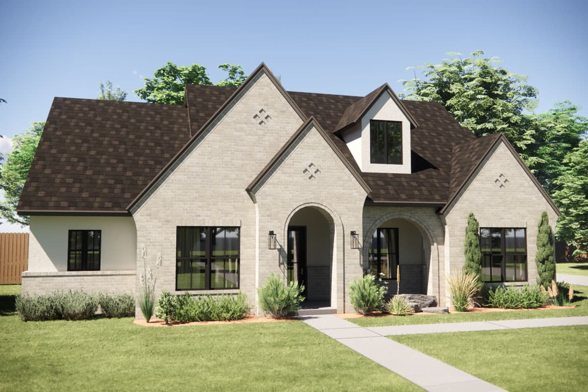 House plan exterior with two stories, brick facade, arched entryways, gables, and dormer windows.