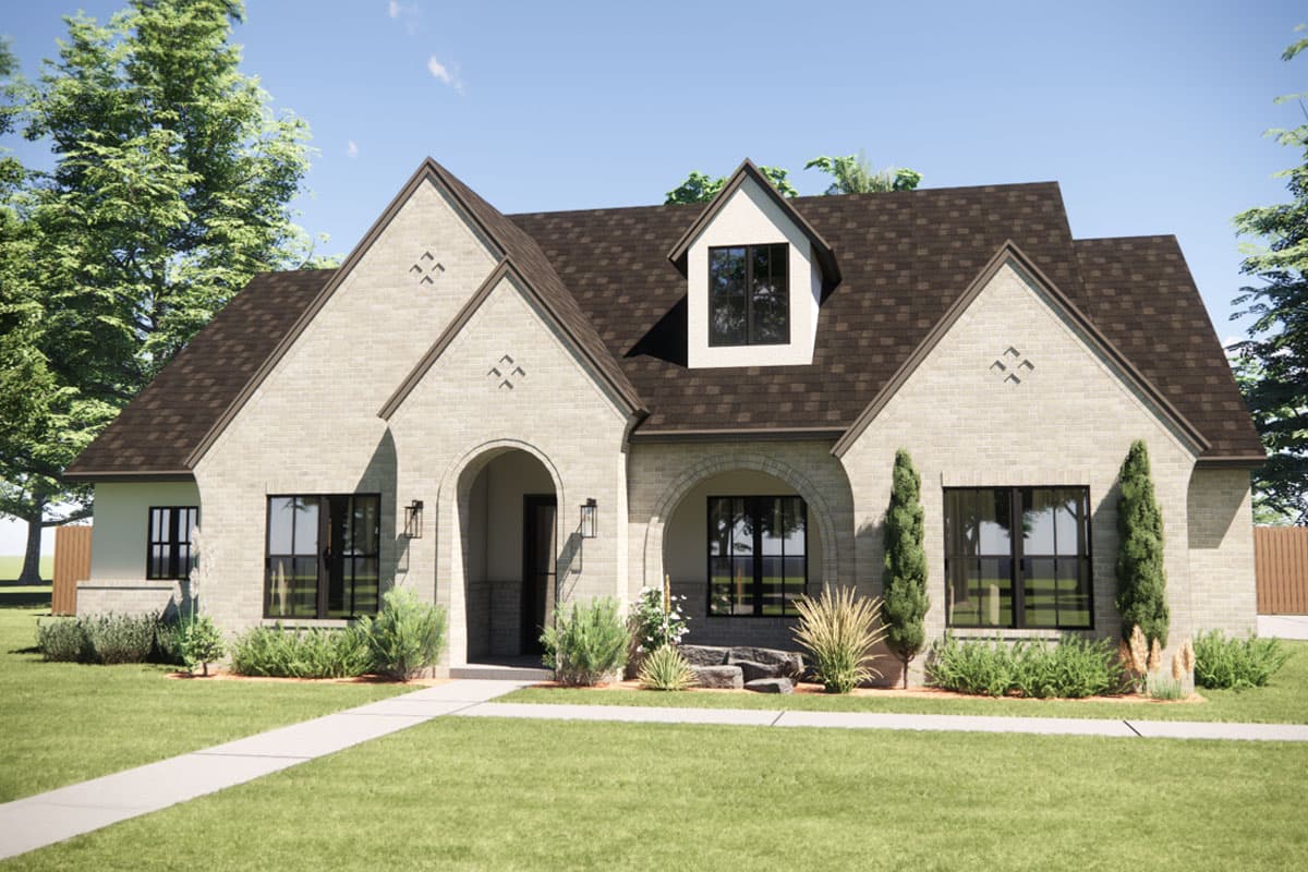 House plan exterior rendering with brick facade, arched entryways, multiple gables, and a dormer window.