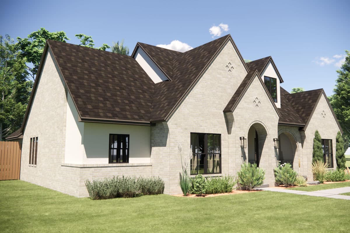 House plan exterior: One-story modern farmhouse with brick facade, arched entryways, dormers, and steep gables.