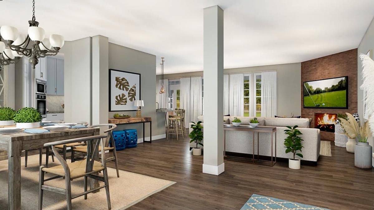 Open concept living area with dining room, kitchen island, and living room featuring a fireplace and television.