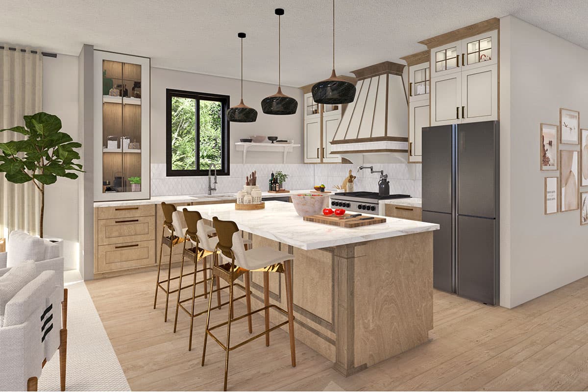 Kitchen interior with island, range hood, refrigerator, cabinetry, and sink.