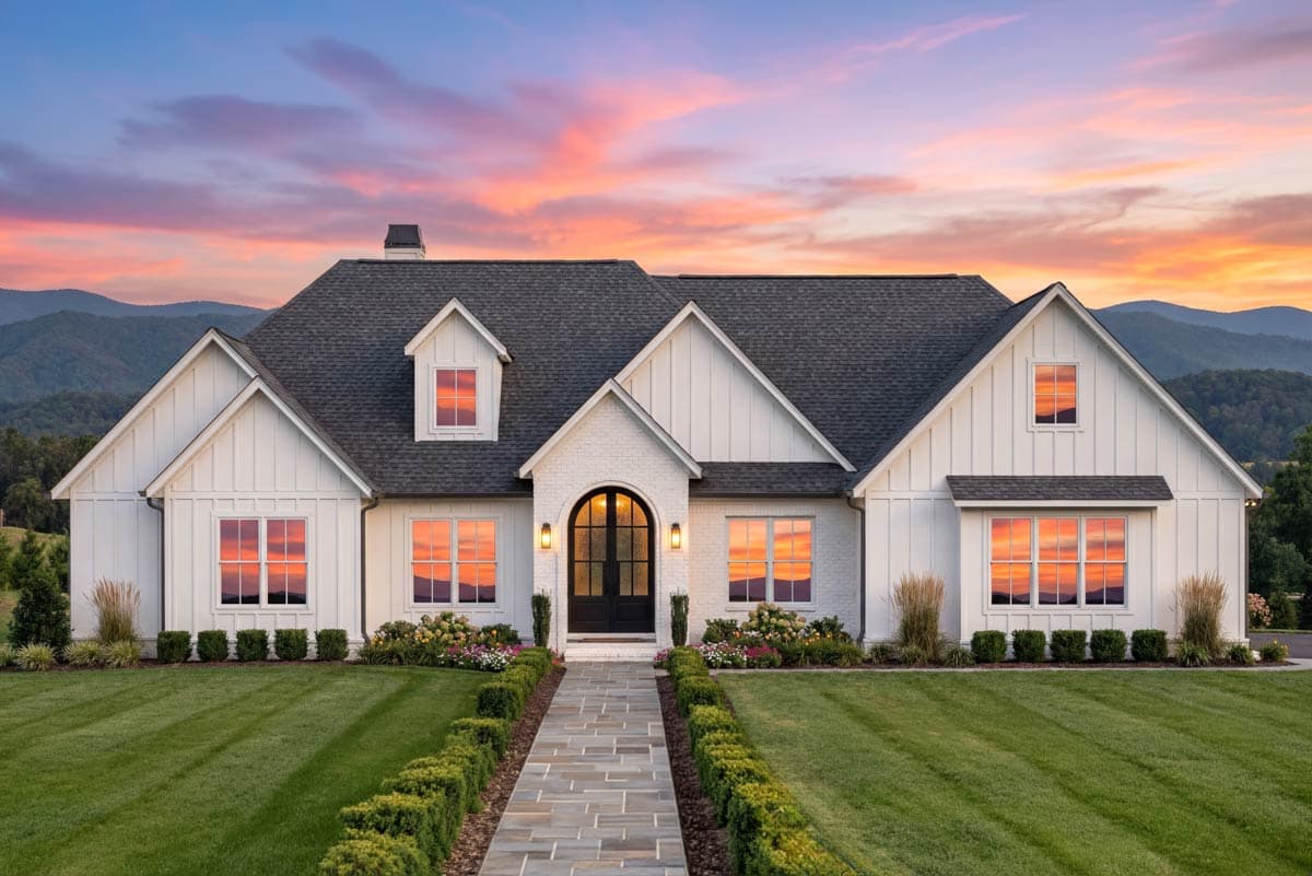 Modern Farmhouse house plan exterior with board and batten siding, gables, dormers, and arched entry.