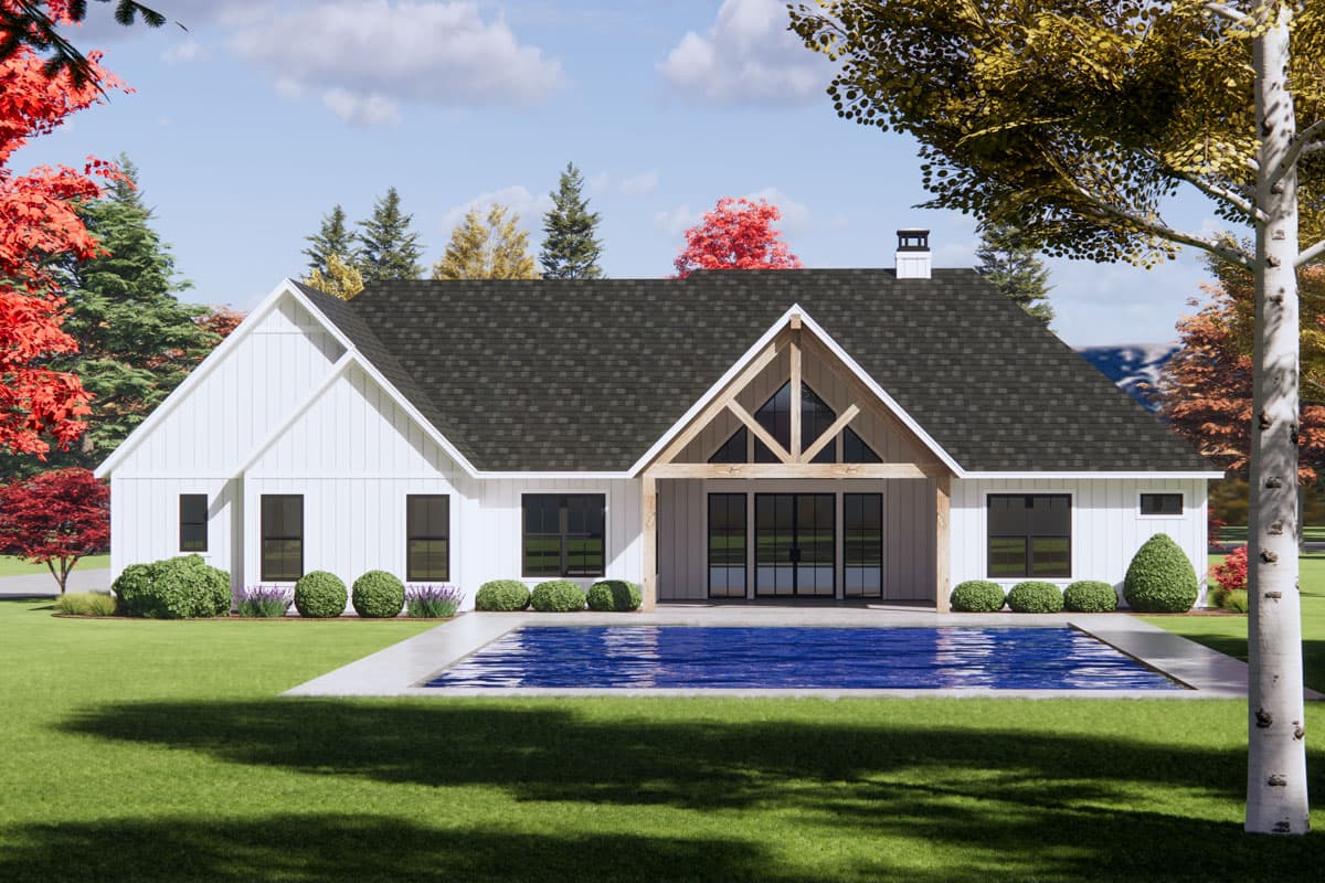 Modern Farmhouse house plan exterior with white board and batten siding, dark windows, gabled roof, and a covered patio.