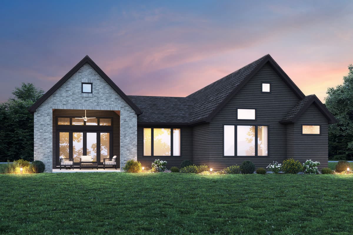 House plan exterior: Single-story Modern Farmhouse with stone accents, gable roof, covered entry with large glass doors, and dark horizontal siding.