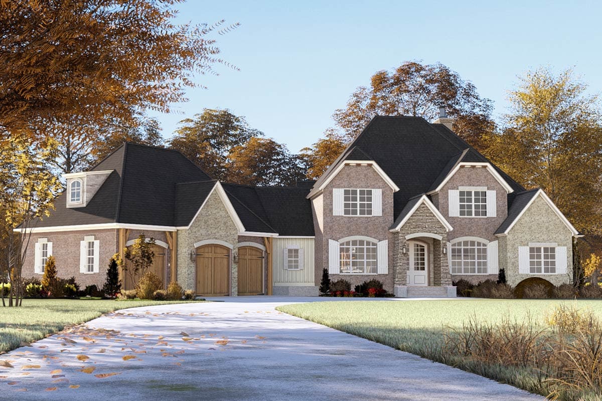House plan exterior: Two-story brick home with stone accents, dual garage doors, multiple gables, dormers, and arched windows.