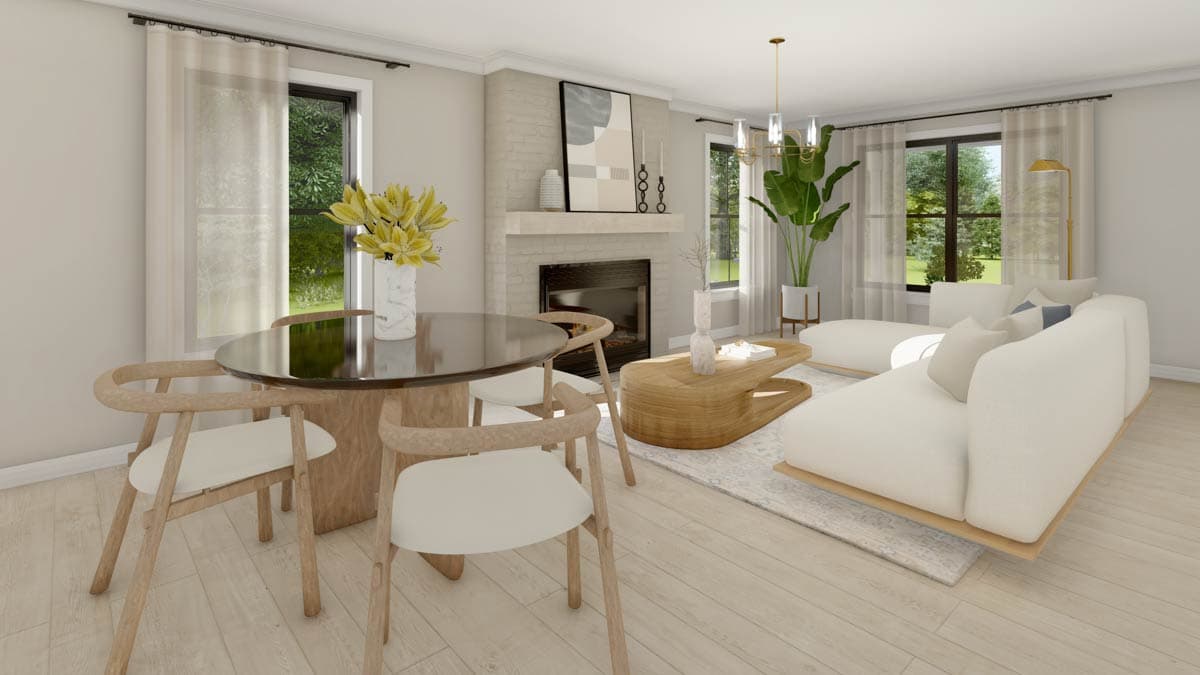Living room with dining area, fireplace, sectional sofa, coffee table, and large windows with sheer curtains.