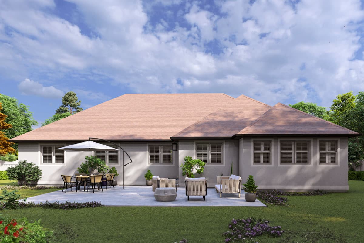 House plan exterior: single-story home with a prominent hip roof and a large patio area with outdoor seating.