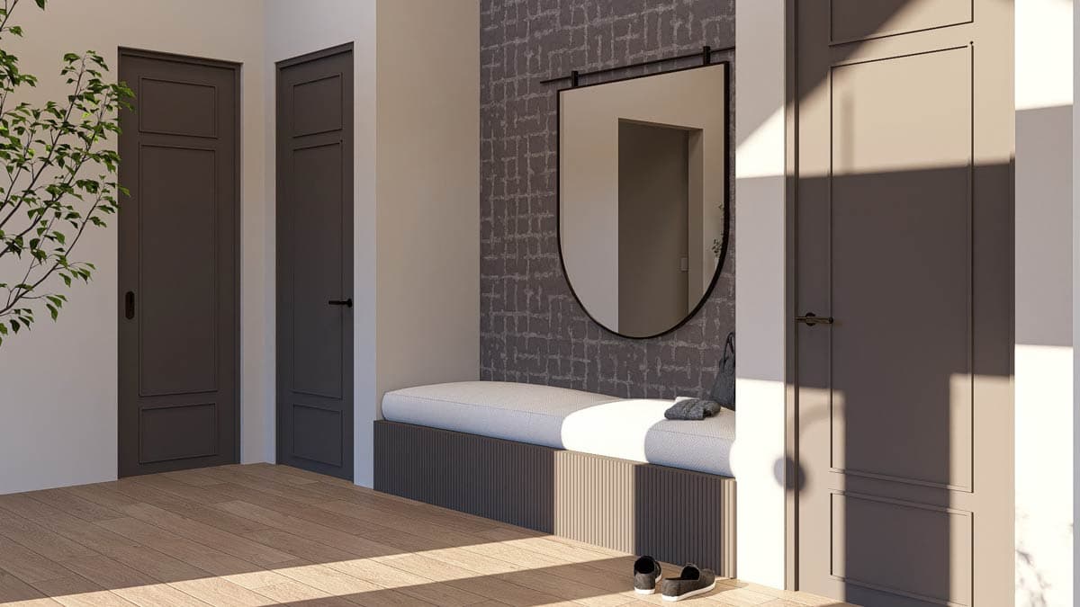 Interior view: entryway with paneled doors, built-in bench, decorative mirror, and wood flooring.