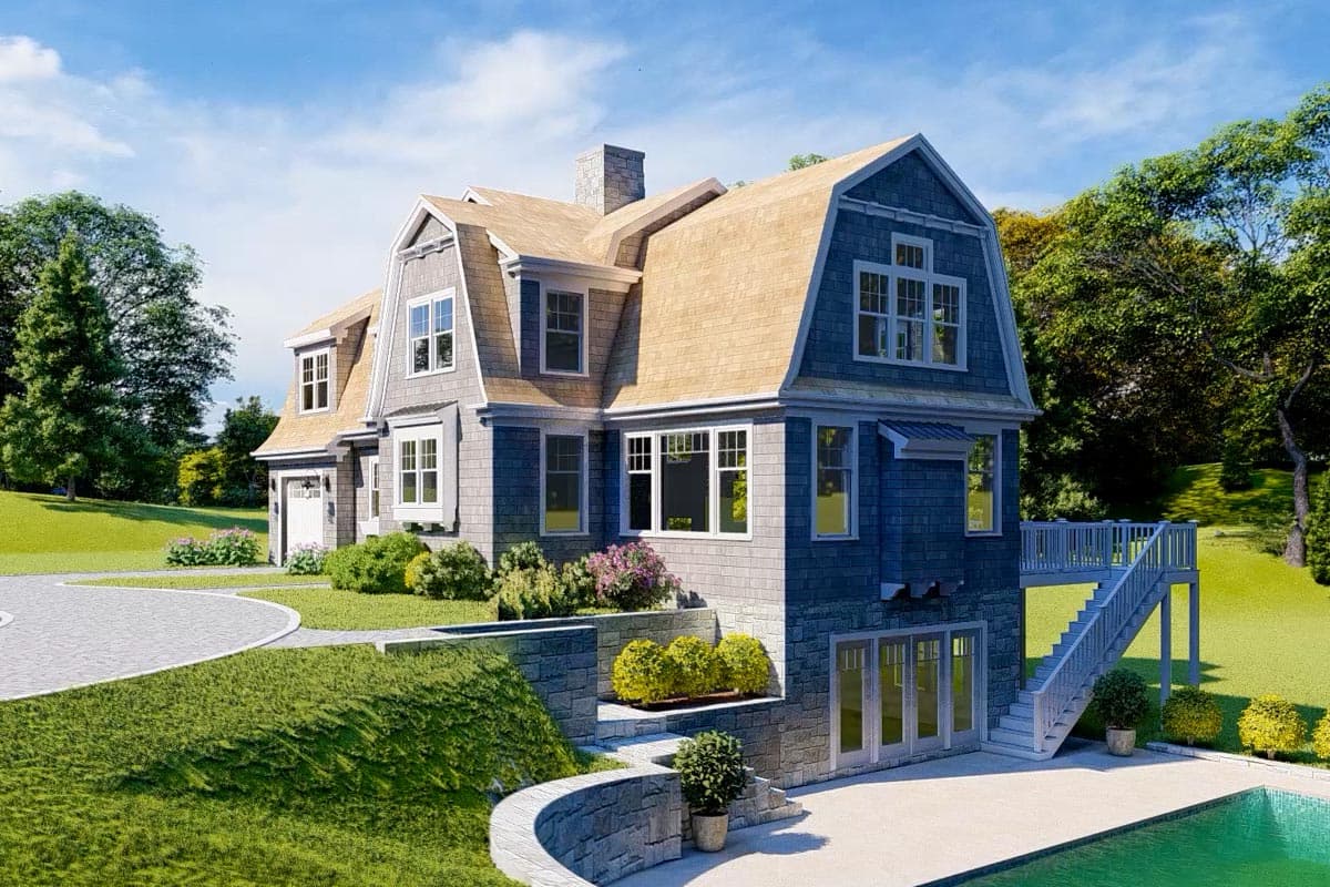 House plan exterior: Dutch Colonial style, multiple gables, dormers, shingle siding, stone accents, and a detached garage.