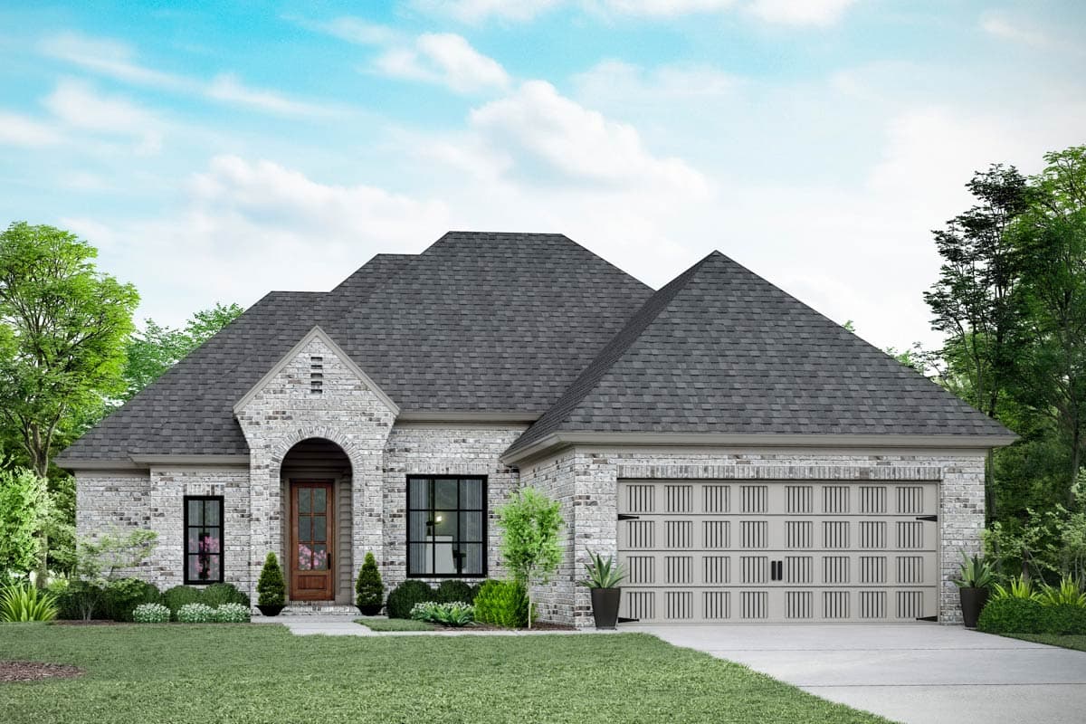 House plan exterior. One-story house in brick with a gabled roof, arched entryway, and attached garage. Includes a front yard with landscaping.