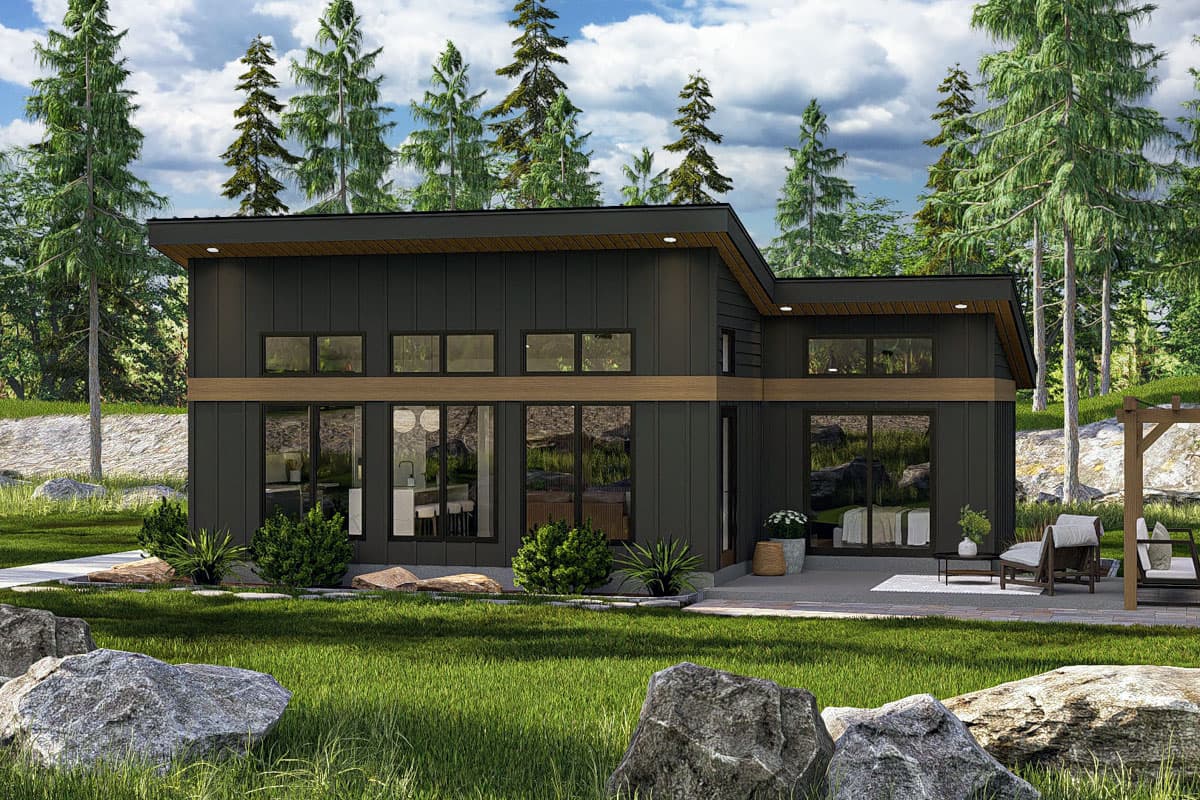 House plan exterior. Modern style, two stories, flat roof, large windows, and an outdoor patio are visible.