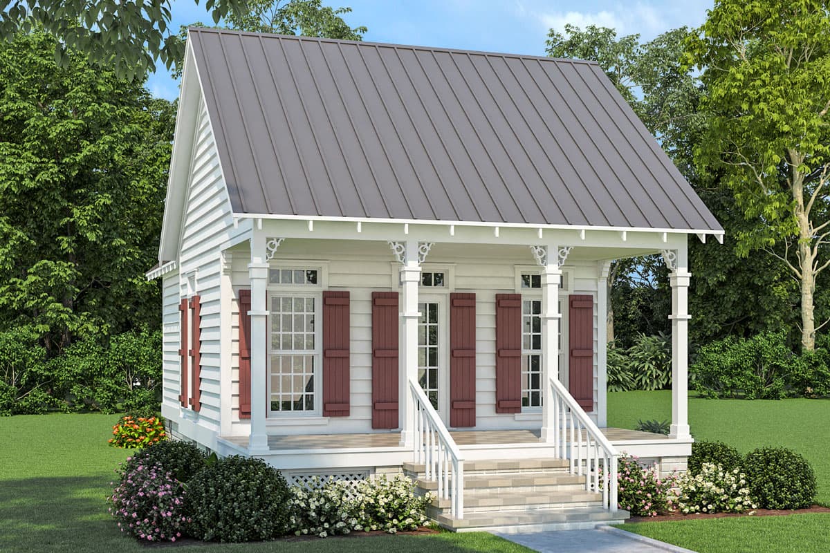 House plan exterior. One-story cottage with porch, gable roof, and decorative corbels. Features include vertical siding and shuttered windows.