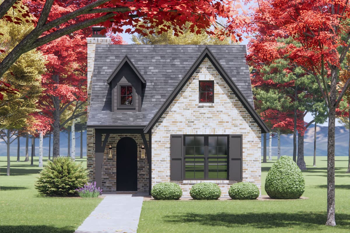 House plan exterior. Two-story brick facade house with a gabled roof, dormer, and arched entry. Features black shutters and trim.