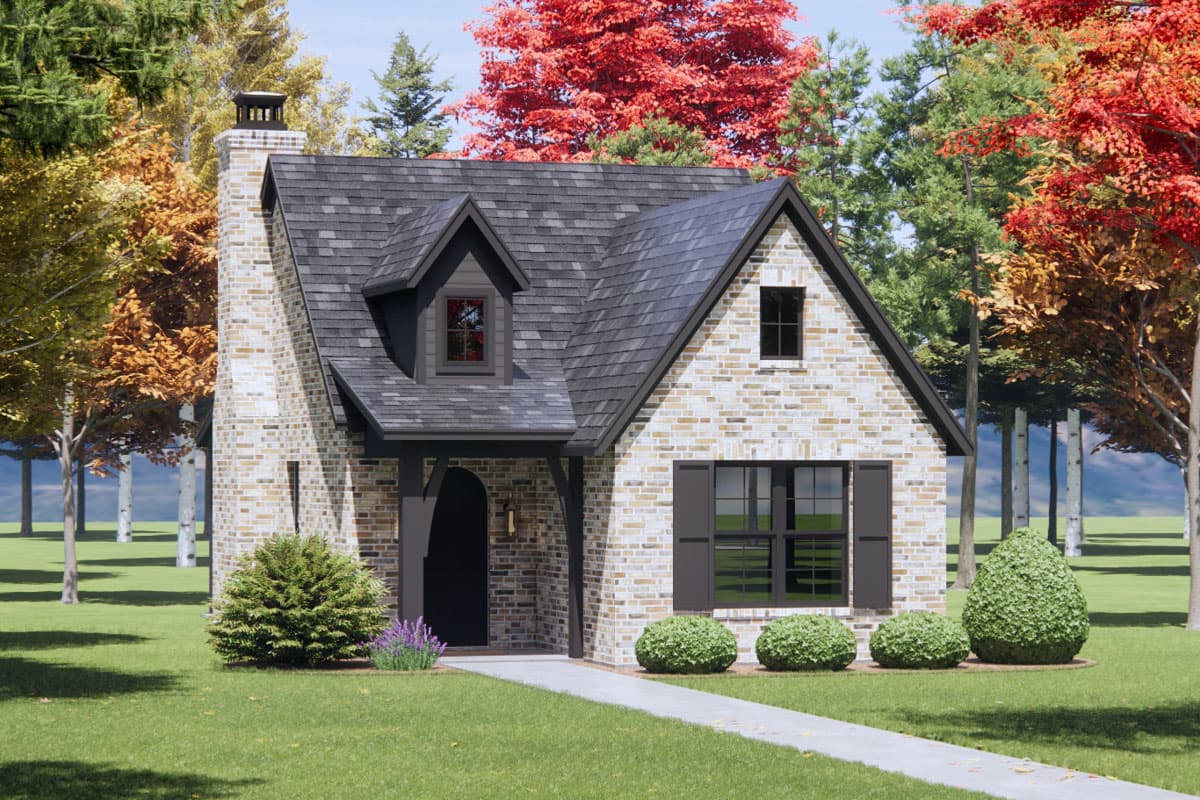 House plan exterior: Two-story brick home with prominent chimney, gabled dormer, and covered entry with arched doorway.