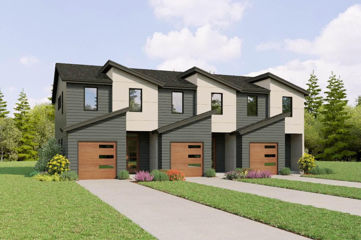 Modern townhouse exterior with angled rooflines, two stories, garages, and contrasting siding.