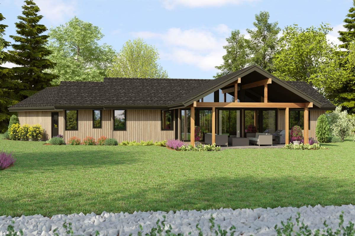 Ranch house plan exterior with wood siding, dark gabled roof, and covered patio with exposed beams and outdoor furniture.