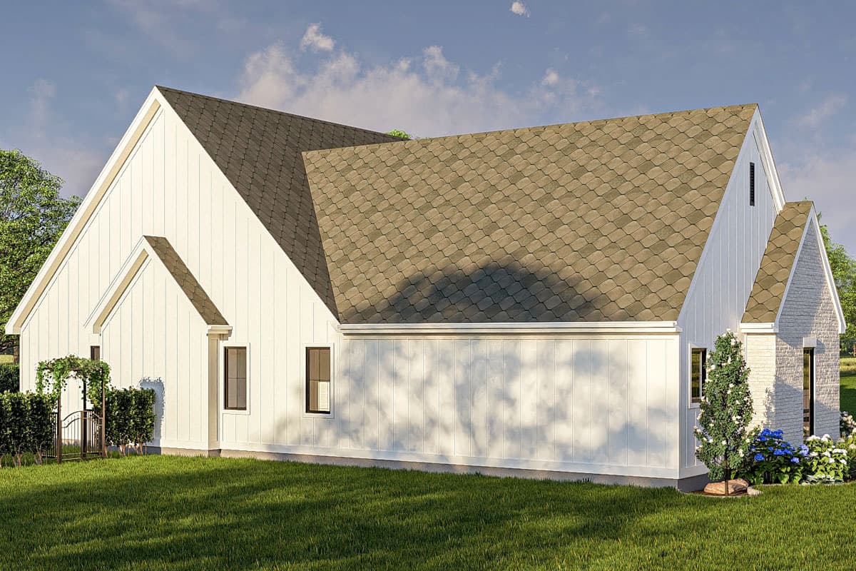 House plan exterior with white vertical siding, gabled rooflines, and a brick section.