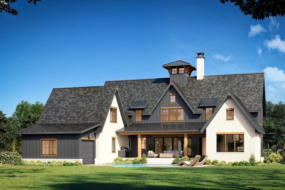 Modern Farmhouse style house plan exterior with white brick, dark siding, gables, dormers, covered patio, and attached garage.