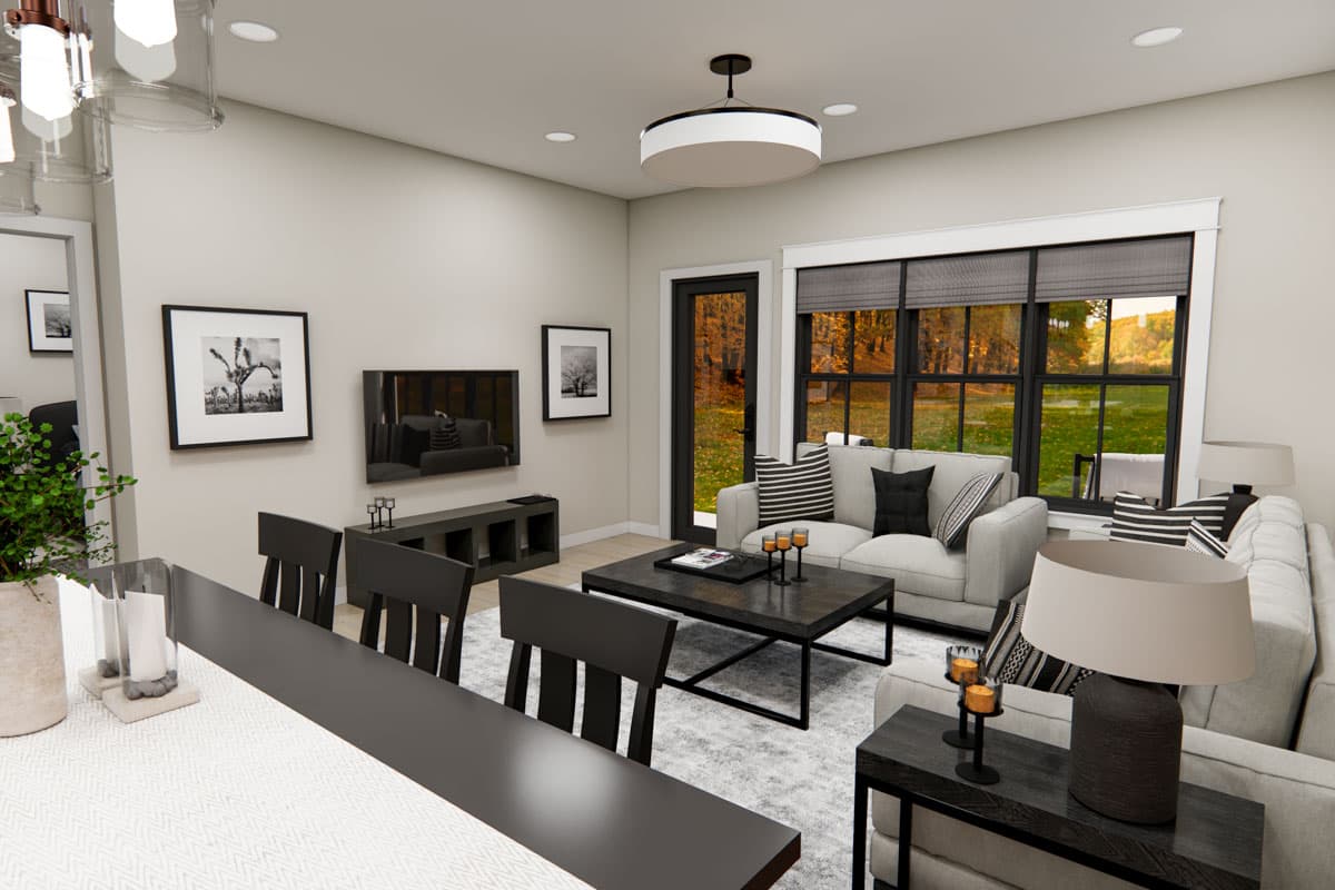 Interior rendering of a living room with sofas, coffee table, entertainment unit, and large windows with autumn views.