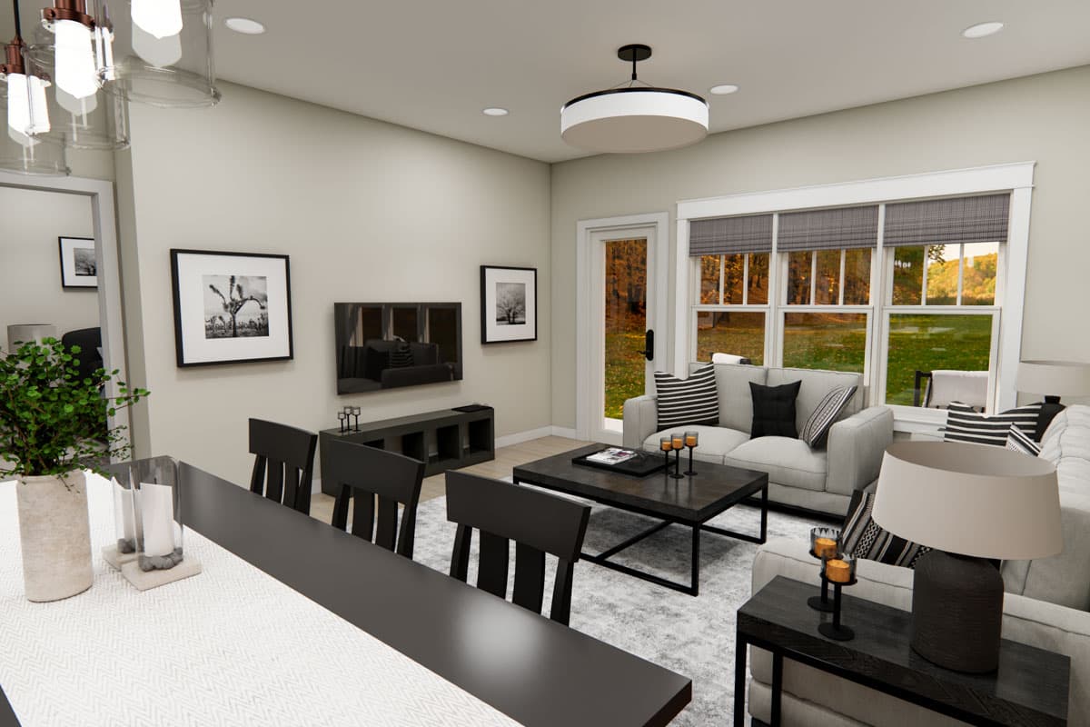 Living room rendering with sectional sofa, coffee table, media console, dining chairs, and large windows overlooking an autumn landscape.