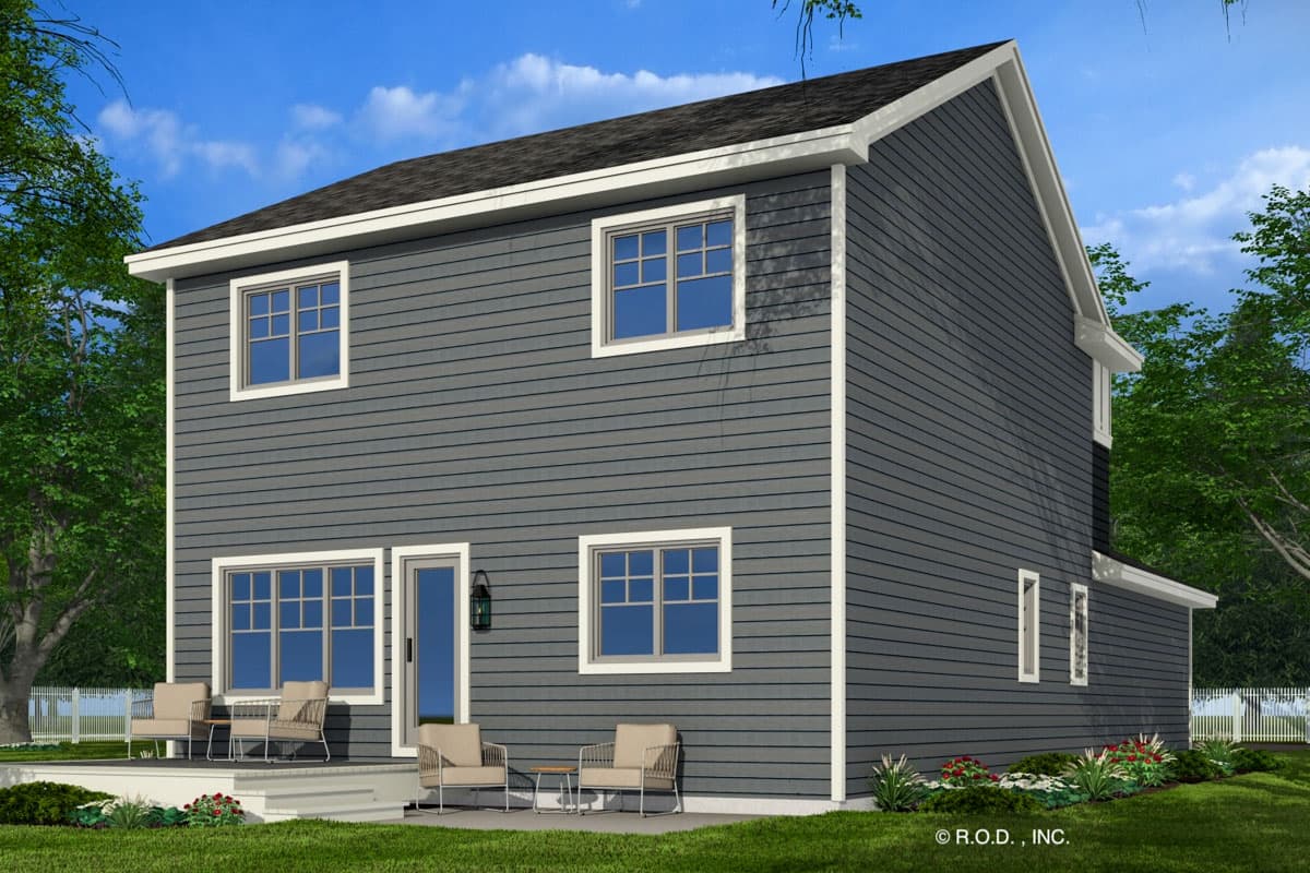 House plan exterior: two-story home with dark gray siding, white trim, multiple windows, and a covered deck with seating.