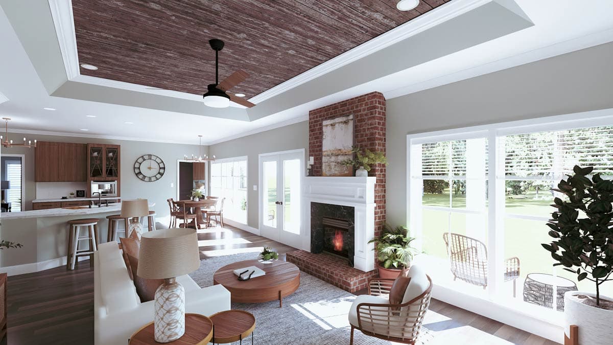 Open-concept living area with kitchen island, brick fireplace, and wood-planked coffered ceiling.