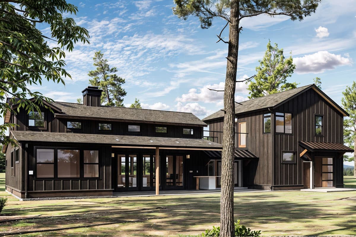 Modern Farmhouse house plan exterior with dark vertical siding, gable roof, and covered porch with large glass doors.