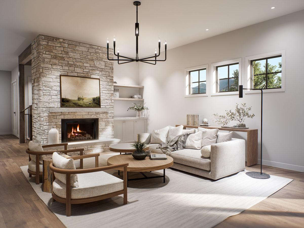 Living room with stone fireplace, sofa, chairs, coffee table, and three windows.