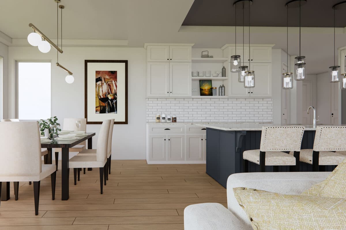 A modern kitchen and dining area featuring a dark wooden dining table set for dinner, and a large kitchen island with bar stools.