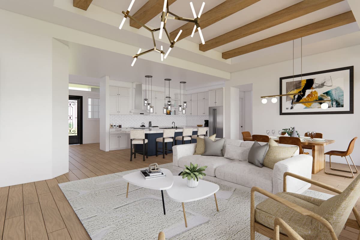 Open concept living space with vaulted ceiling, exposed beams, modern kitchen, island, and dining area.