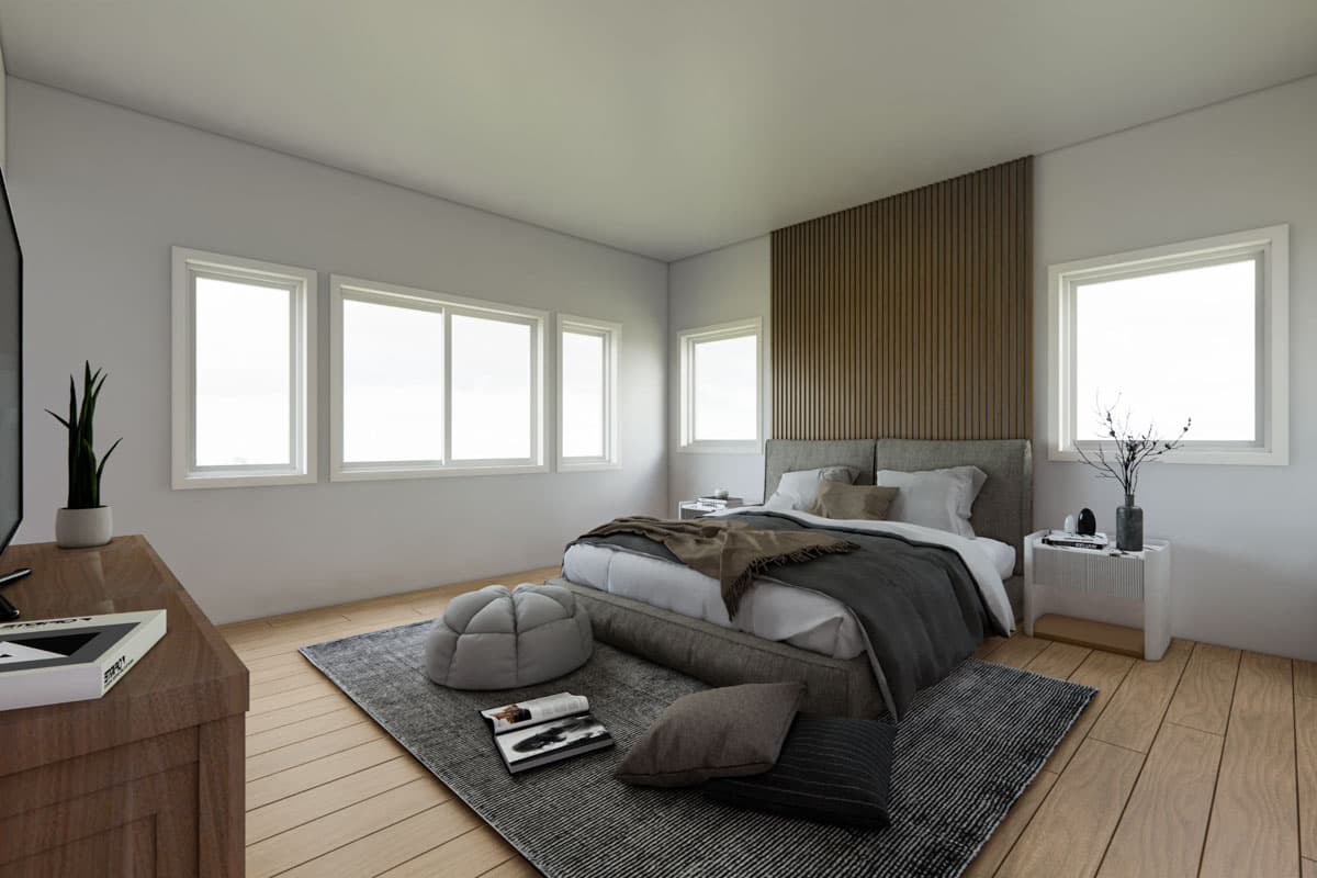 Primary bedroom with queen bed, wood-slatted accent wall, and multiple windows. Open layout.
