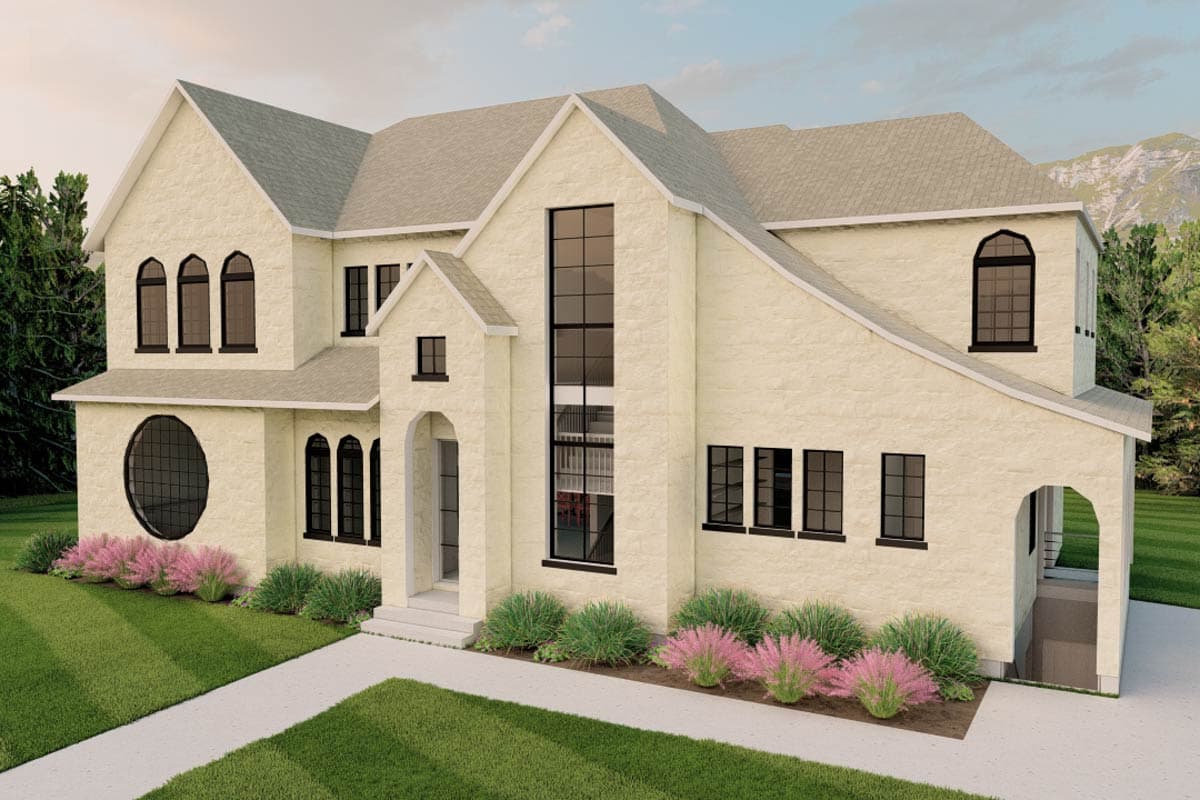 House plan exterior featuring a steep gable roofline, arched windows, a circular window, and an arched entry.