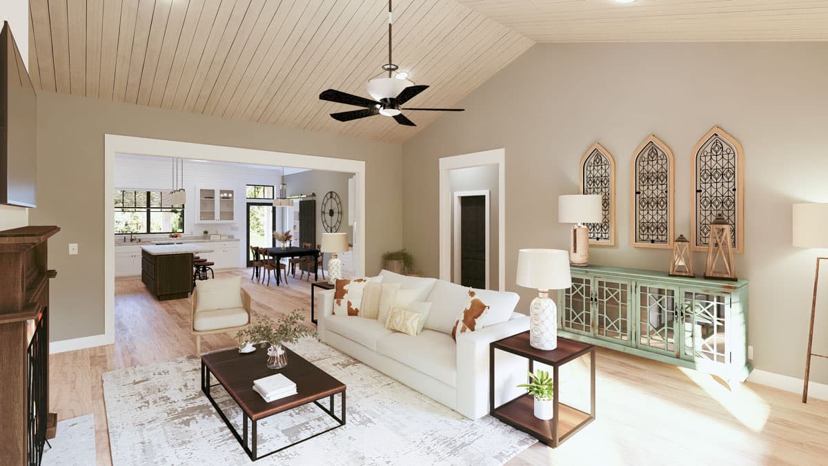 Interior rendering of a great room with vaulted wood-paneled ceiling, fireplace, and open view to kitchen and dining area.