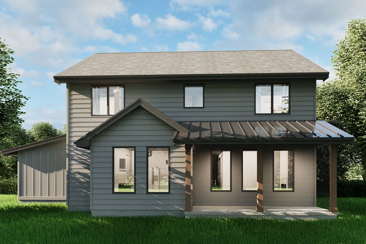 A modern two-story house with gray siding and black framed windows, a covered porch, and a surrounding green lawn under a blue sky.